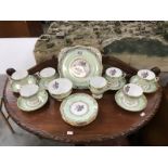 A part Dakin bone china tea set including 6 cups and saucers,