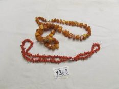 A yellow amber necklace and a red coral necklace.