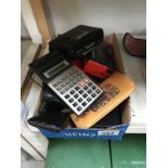 A quantity of calculators & mobile phones etc.