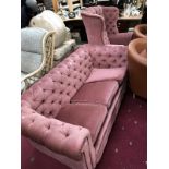 A pink button back Chesterfield sofa and a button back chair