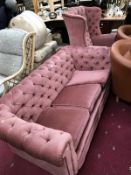 A pink button back Chesterfield sofa and a button back chair