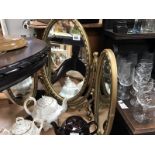 A dressing table triptych mirror in gold frame and a gold patinated standard lamp