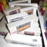 Approximately 30 '00' gauge rolling stock in home made boxes.
