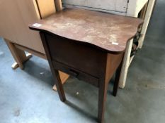 A wooden long legged sewing box with contents