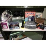 A shelf of electrical items including CD player etc.