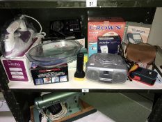 A shelf of electrical items including CD player etc.