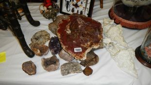 A large amethyst and other stone and crystal objects.