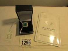 An 18ct white and yellow gold large emerald and diamond cluster ring together with EDR certificate