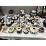35 pieces of Jersey pottery of posy bowls and flower holders