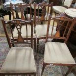 A set of 4 mahogany inlaid dining chairs.