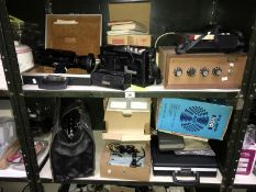 2 shelves of vintage electrical items including film cameras & cassette players etc.