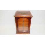 A Victorian mahogany specimen cabinet with glass door and 21 numbered drawers containing microscope