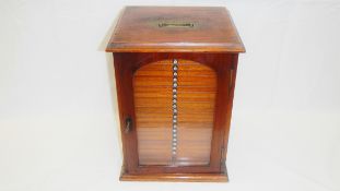 A Victorian mahogany specimen cabinet with glass door and 21 numbered drawers containing microscope
