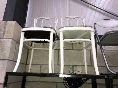 A pair of white painted Bentwood chairs