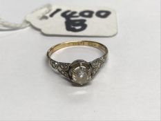 A gold diamond solitaire ring, size J.