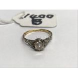 A gold diamond solitaire ring, size J.