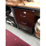 A dark brown office chest of 3 drawers