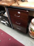 A dark brown office chest of 3 drawers