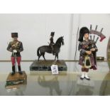 A guard on horseback with marble base, signed Caton '75 together with 2 other soldier figures.