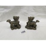 A pair of small heavy brass Chinese dragons,.