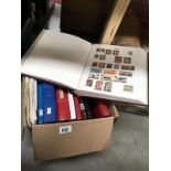 A box of 9 stamp albums