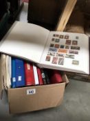 A box of 9 stamp albums