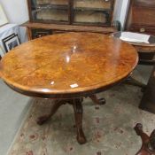 An oval walnut tip top loo table.