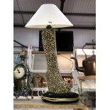 A retro leopard boot table lamp