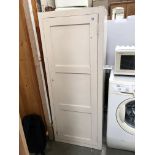 A white painted kitchen storage cabinet