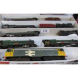 A tray of '00' gauge locomotives and tenders.