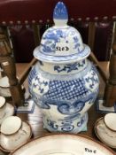 A large blue and white ginger jar