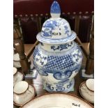 A large blue and white ginger jar