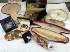 A quantity of costume jewellery including cased necklaces & compacts etc.