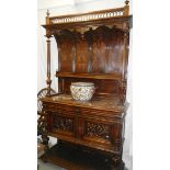 An unusual sideboard with marble top and concaved back.