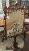 A Victorian rosewood fire screen with glazed tapestry panel.