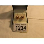 A pair of 9ct gold earrings, approximately 3 grams.