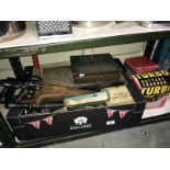 A steel toolbox with tools, including battery charger, saws, electric drill,