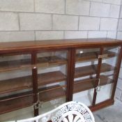 A large 4 door glazed antique mahogany shop display case,