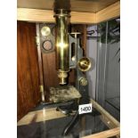 A cased Victorian brass microscope by J.S.Swifts of London with extra lenses.