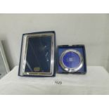 2 silver photograph frames.