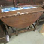 An oak barley twist gate leg table.