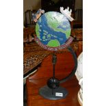 A metal rocking world globe.