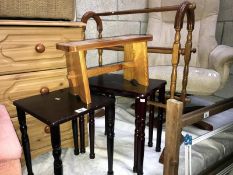 A selection of small wooden furniture including nest of small tables,