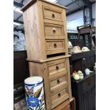 A pair of pine bedside chests of drawers