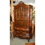 A display cabinet wit 3 drawer 'bombe' base.