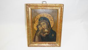 An early framed icon featuring the Virgin Mary, painted on tin.