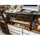 A dark brown coffee table with 2 drawers