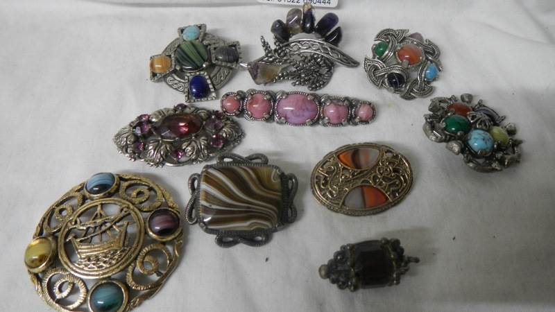A mixed lot of brooches including Scottish.
