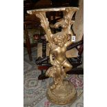 A gilded cherub figure.