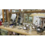 A mixed lot of silver plate including spill vases, jugs etc .